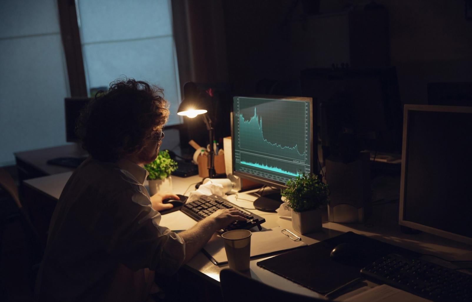 Team collaboration workspace with data visualization screens